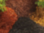 multi colored mulch in piles on the ground