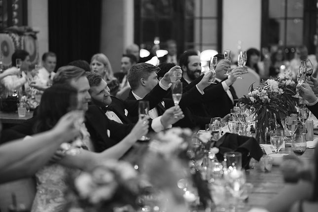 Elegant Wedding Toast with Guests Raising Champagne