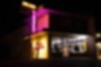 Neon sign of Golden Liquors architectural photography at night
