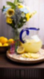 Fresh lemonade pitcher and floral food photography