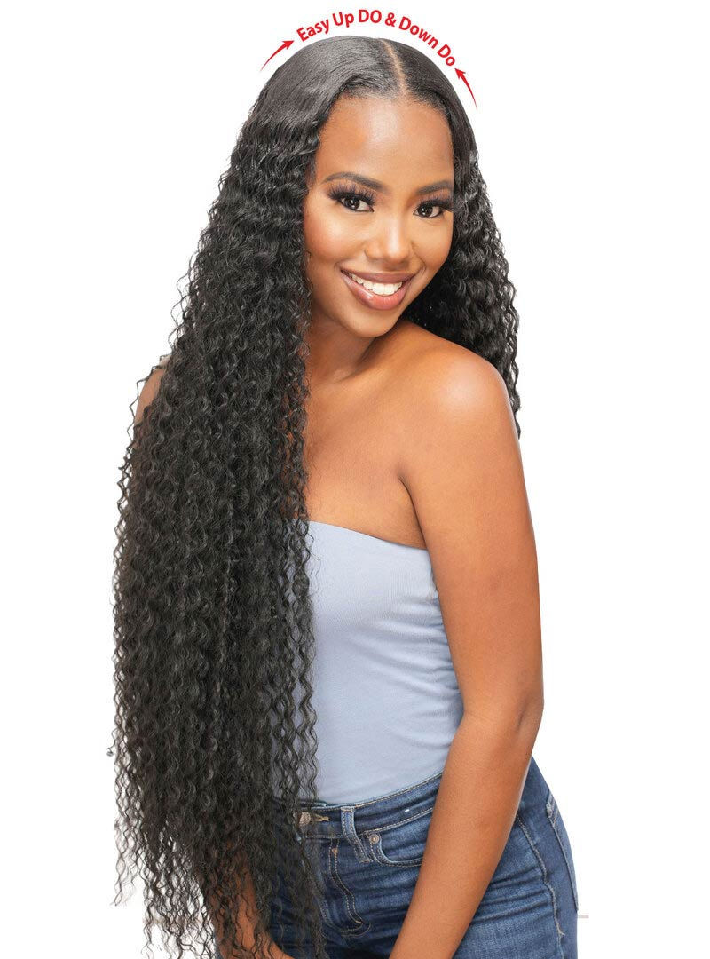 Thumbnail: Smiling woman with long curly hair posing in a studio for product shot.
