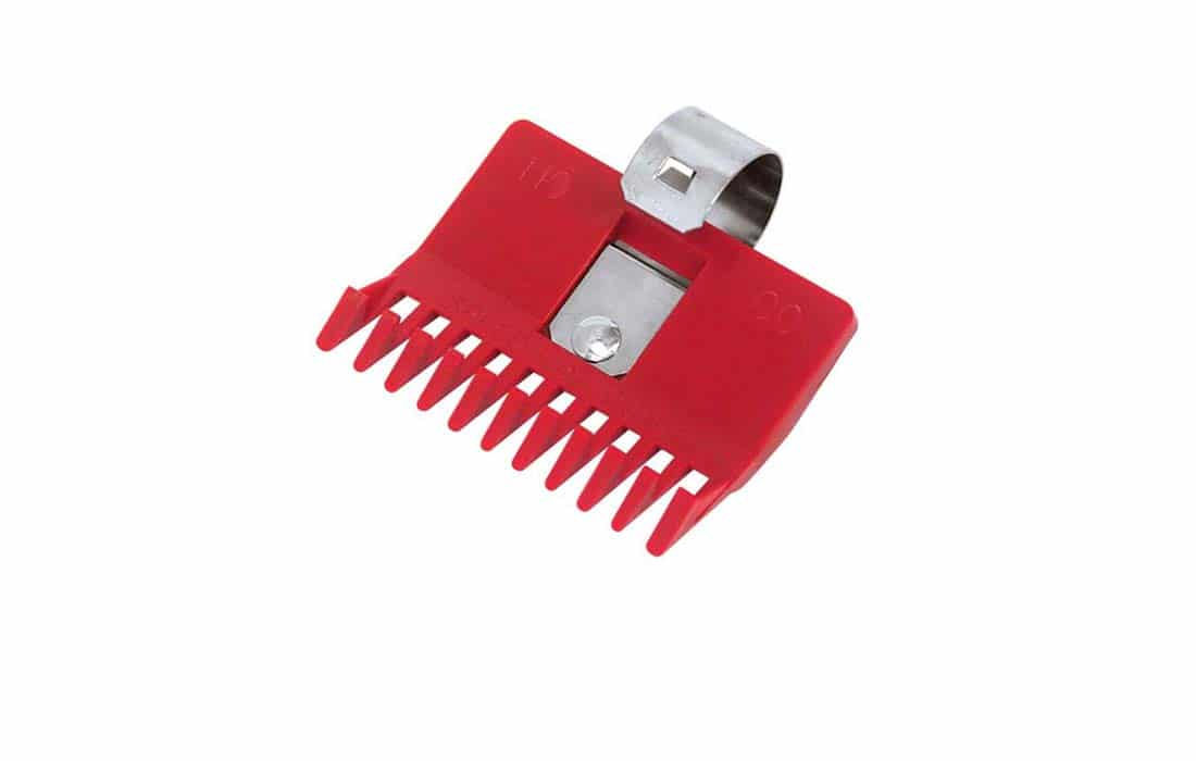 Red hair clipper guard with metal clip on white background. Number 1/8 shown.