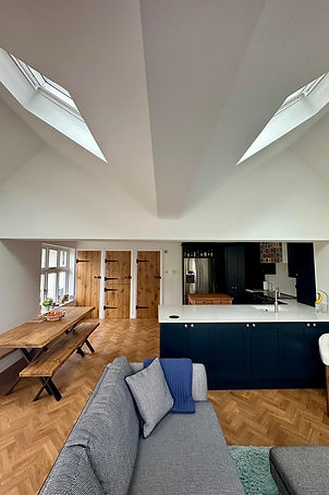 Contemporary interior at Windlesham thatched cottage with garden views and natural light