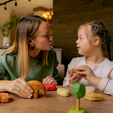 Mother and daughter playing with wooden toys