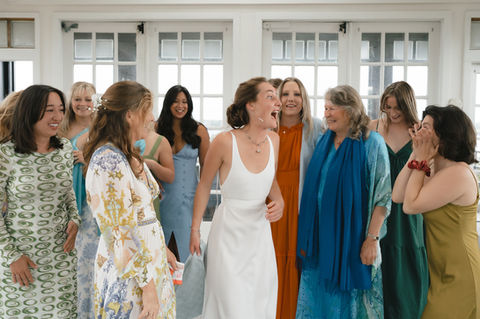 Dragonline Studio in Jamestown, RI, is an exclusive waterfront venue ideal for intimate weddings. With unique architectural design and serene coastal views, it offers a modern, private setting. Maddie Van, a wedding photographer, captures its beauty with high-end, timeless photography.