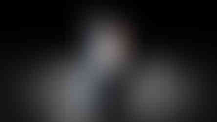 a silhouette of a man standing next to a nike sign