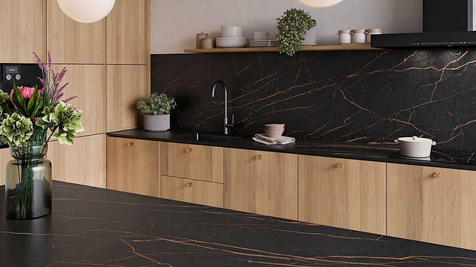 Modern kitchen with light wood cabinets, black marble countertops, and two globe pendant lights. Green plants and flowers add freshness.