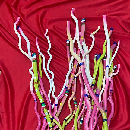Colorfully painted stick's, pre-shaken by Angelina.