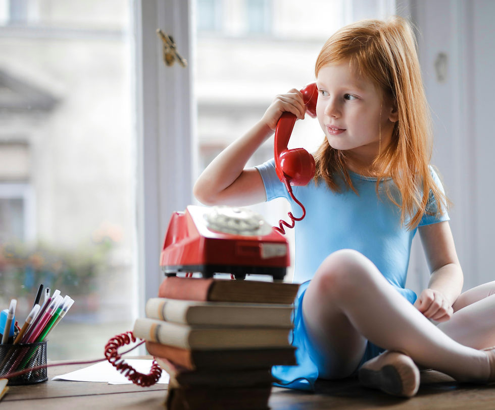 Child communicating by telephone