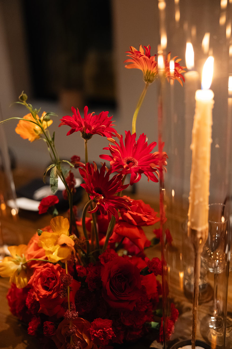 Saturated modern red and orange flowers for a wedding in late fall in Austin, TX