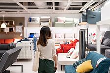 Lady looking in shop for furniture