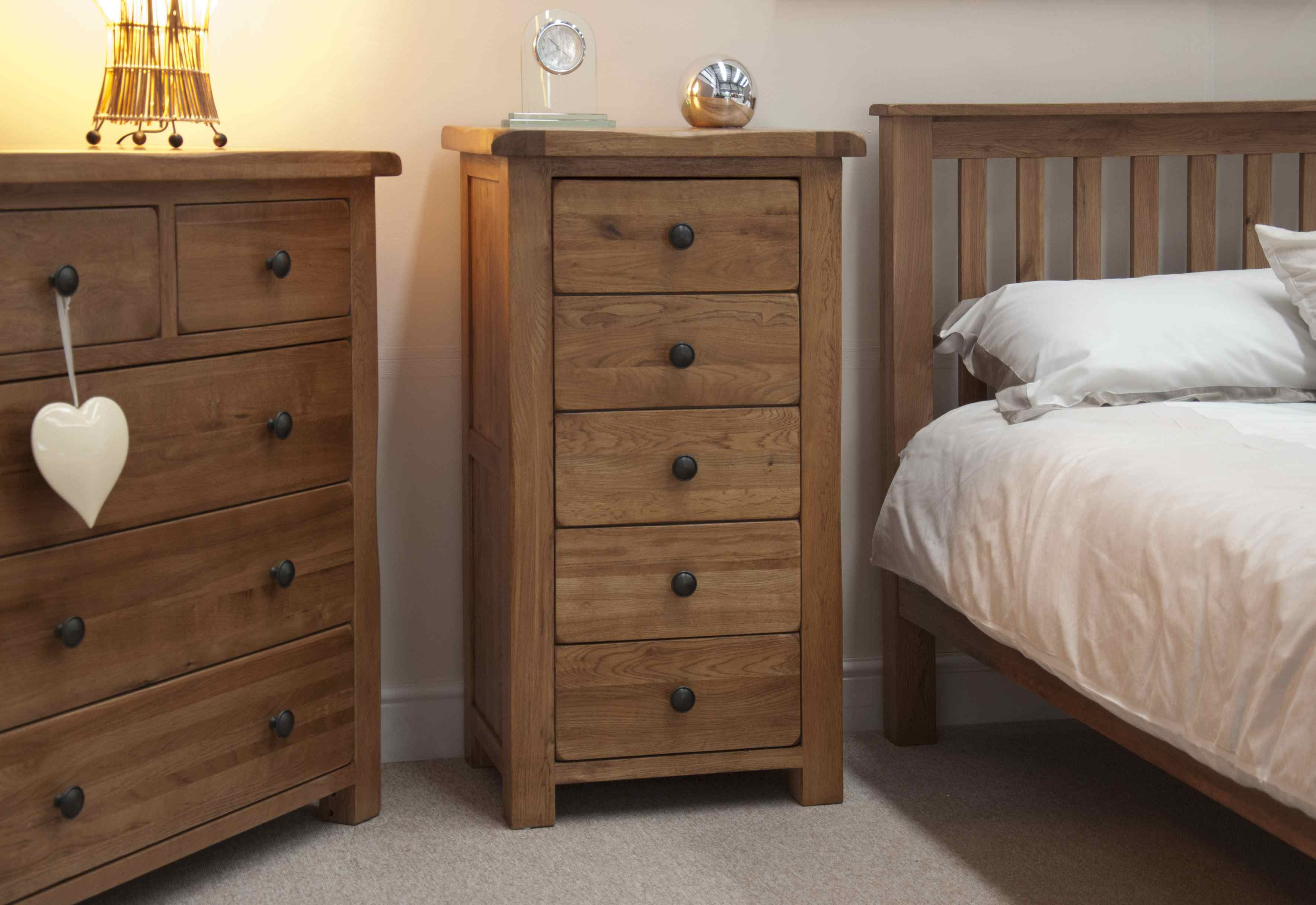 Tall wooden chest of five drawers, rustic bedroom furniture set.