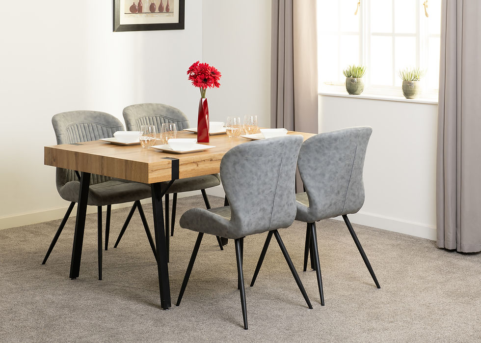 Thumbnail: Modern wooden dining table with grey upholstered chairs in room.