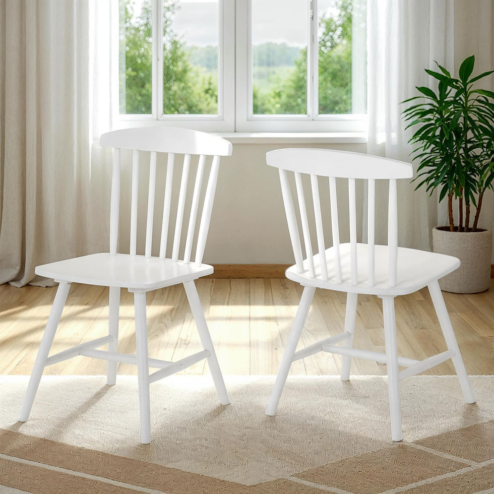 Thumbnail: Two white wooden spindle-back dining chairs on a rug by a window.