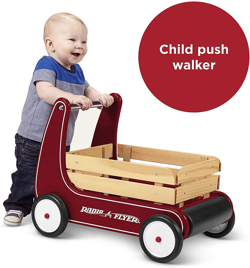 smiling toddler walking with radio flyer push walker