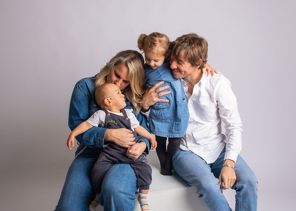 Family is playing cheerfully at Gloucester photography studio