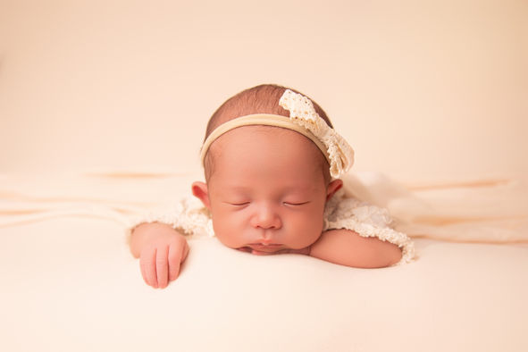 Soft and neutral newborn photography showing a sleeping baby in a Gloucester studio