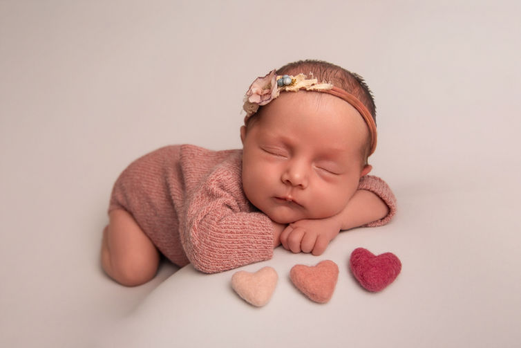 Newborn photography Gloucester capturing tiny hands and feet by Rado Photo Studio.