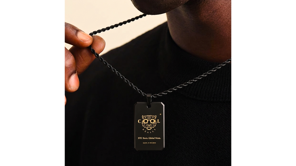 Thumbnail: Close up of the REALLY COOL® SIGNAL Industrial Identity Pendant worn over a black sweater, showcasing the rope chain.
