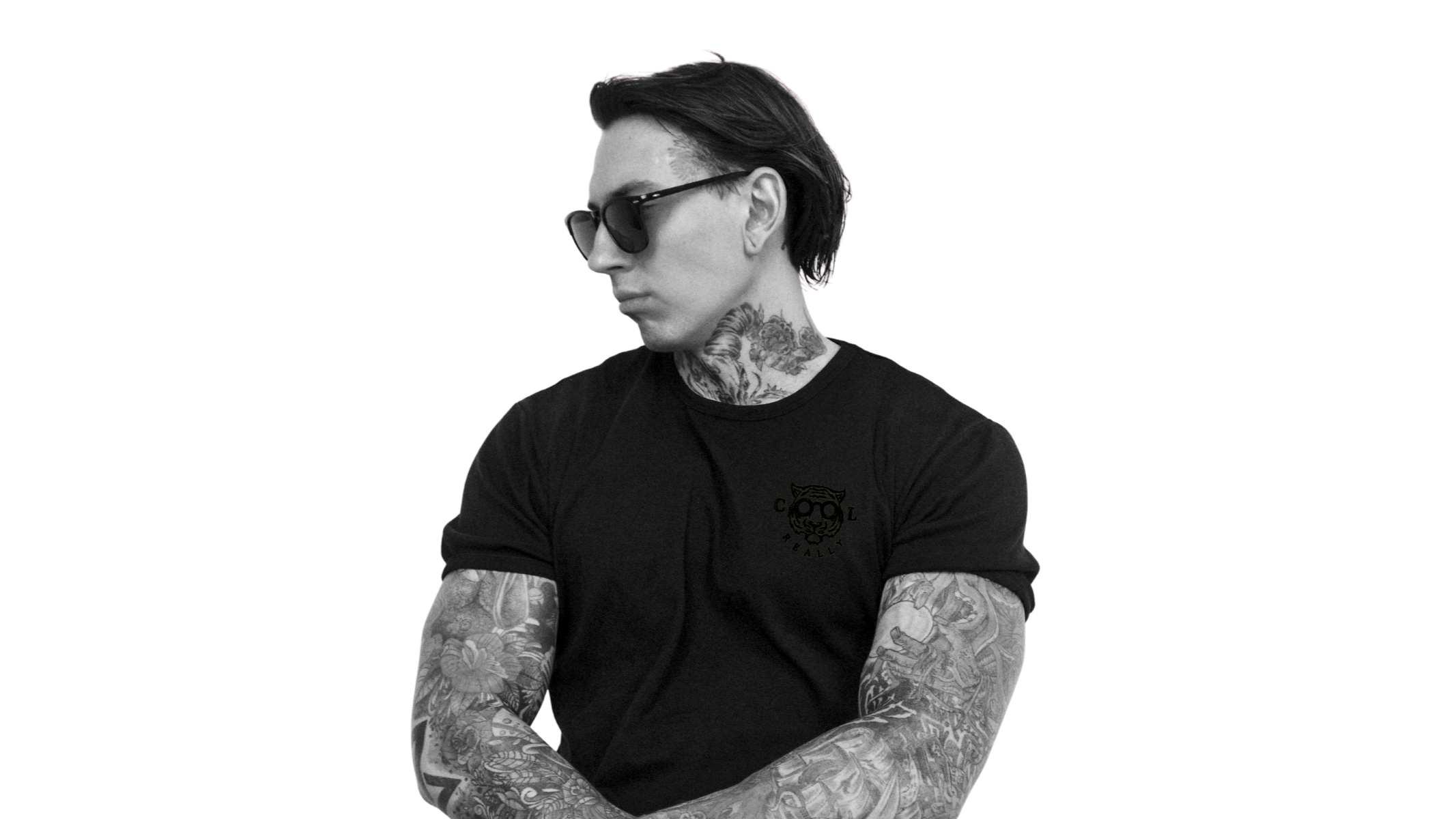 Tattooed model wearing the black REALLY COOL® VOID BX Armor Designer heavyweight tee with a stealth black-on-black logo.