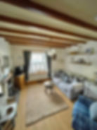 A photograph of a styled interior of Johnnies Cottage in Bainbridge, Yorkshire Dales. The photograph