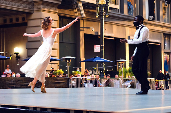 Couple dancing in outdoor performance on a San Francisco street