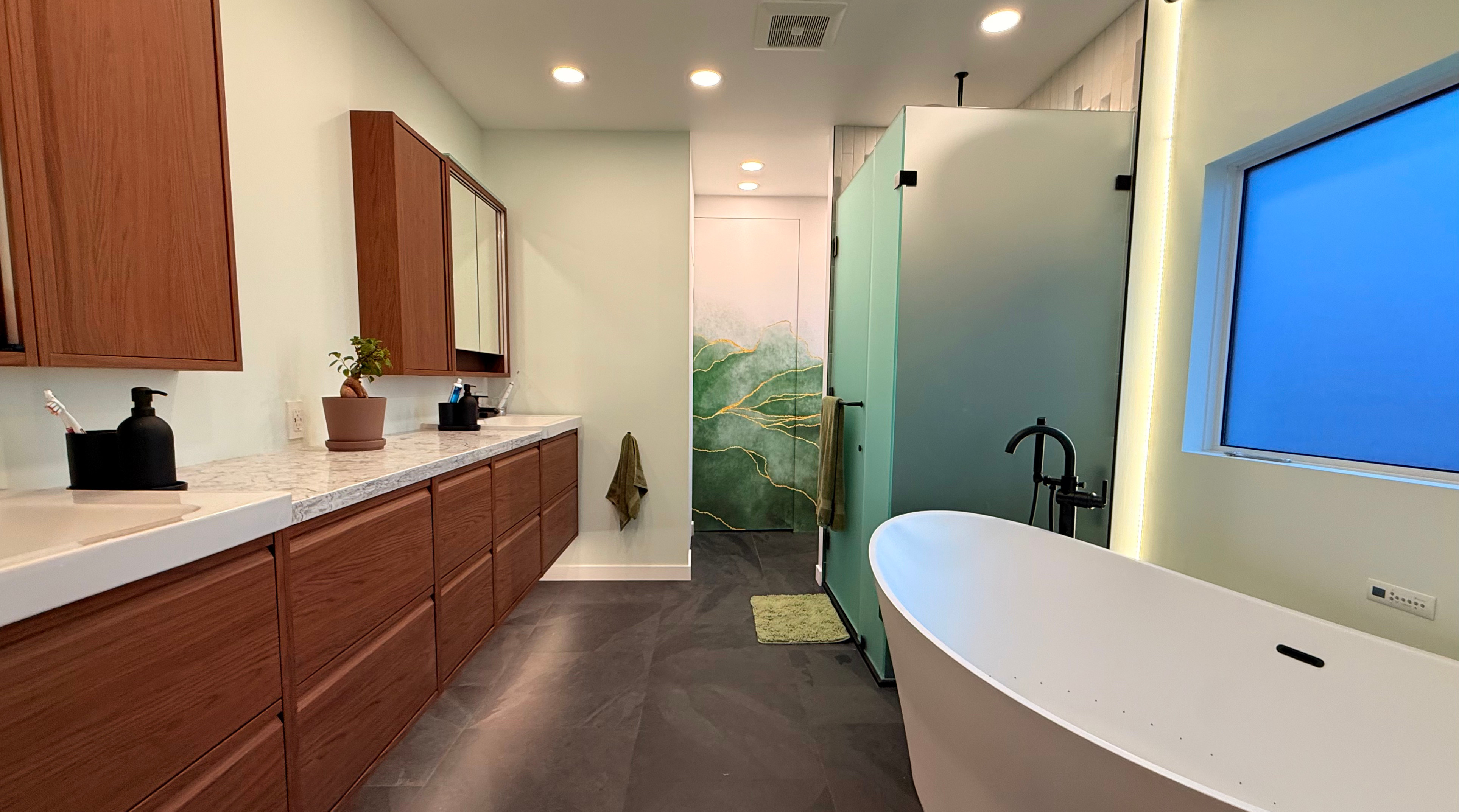 a Beautiful Bathroom Custom Glass Installation is Obscure Satin Etched Glass installed by TVG.