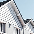 Residential home exterior with siding and roof detail