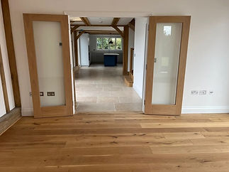 Elegant oak flooring enhances the warmth and beauty of a home with its rich wooden textures and natural tones.