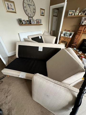 A beige couch in a living room