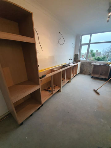 Wooden frame of kitchen countertop and cabinets