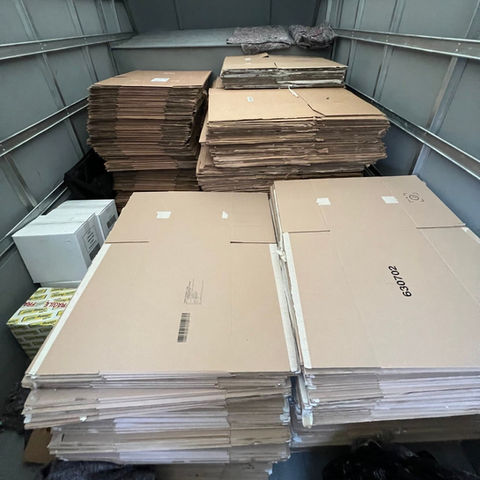 Stack of unmade storage cardboard boxes