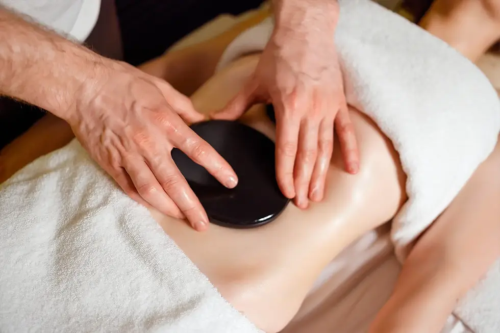 Experience the soothing power of Hot Stones Massage at Revive Therapy Massage & Spa. Warm stones rel