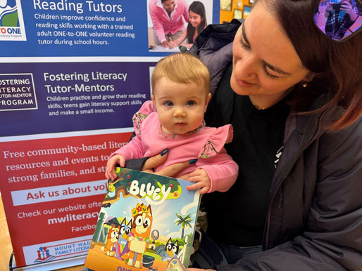 A baby holding a book
