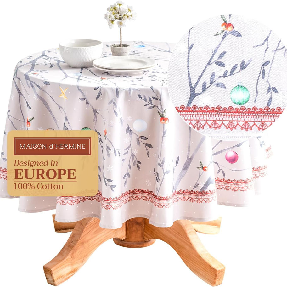 Round tablecloth with twig pattern and 'Designed in Europe 100% Cotton' text