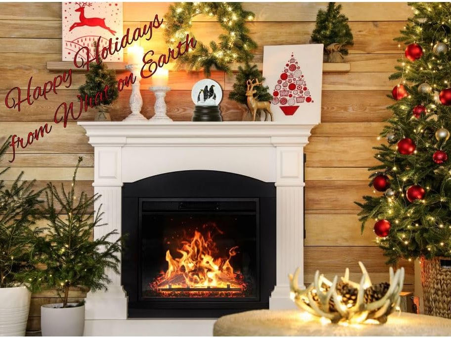 Fireplace with Happy Holidays decorations and a lit fire