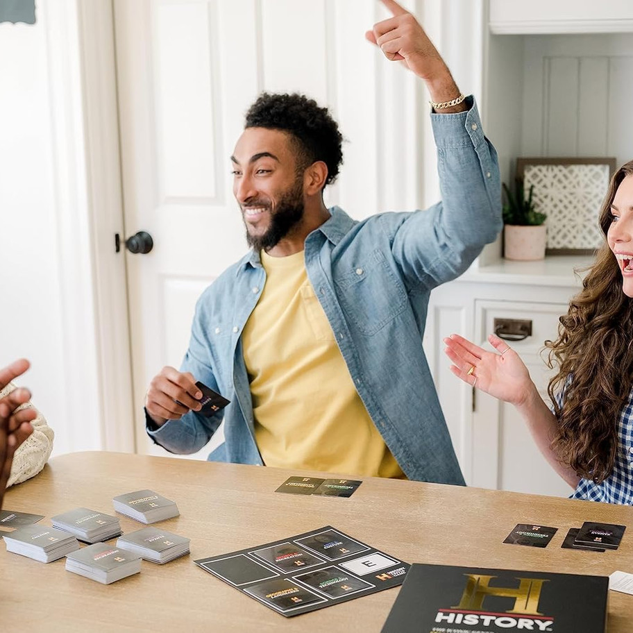 Friends playing History board game