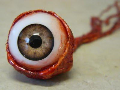 Spooky detached brown eyeball prop