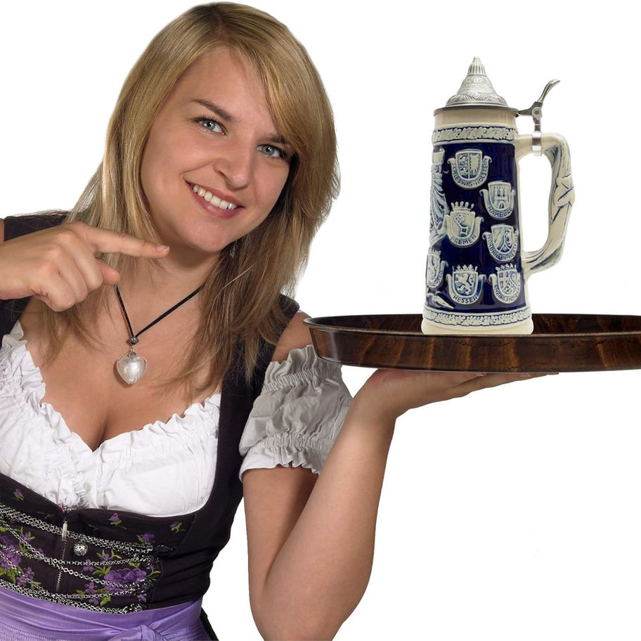 Smiling waitress presenting beer stein on tray