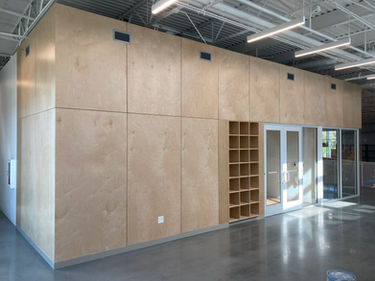 Crux South Austin 2nd floor offices and lounge with finished wall panels. commercial millwork by Welborn Woodworks