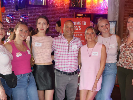 4EG employees wearing pink at the 3rd annual Pink Drink cocktail competition