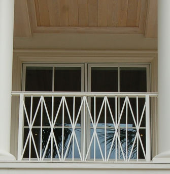 X Patterned British West Indies Rails Florida | Jansen Shutters & Specialties