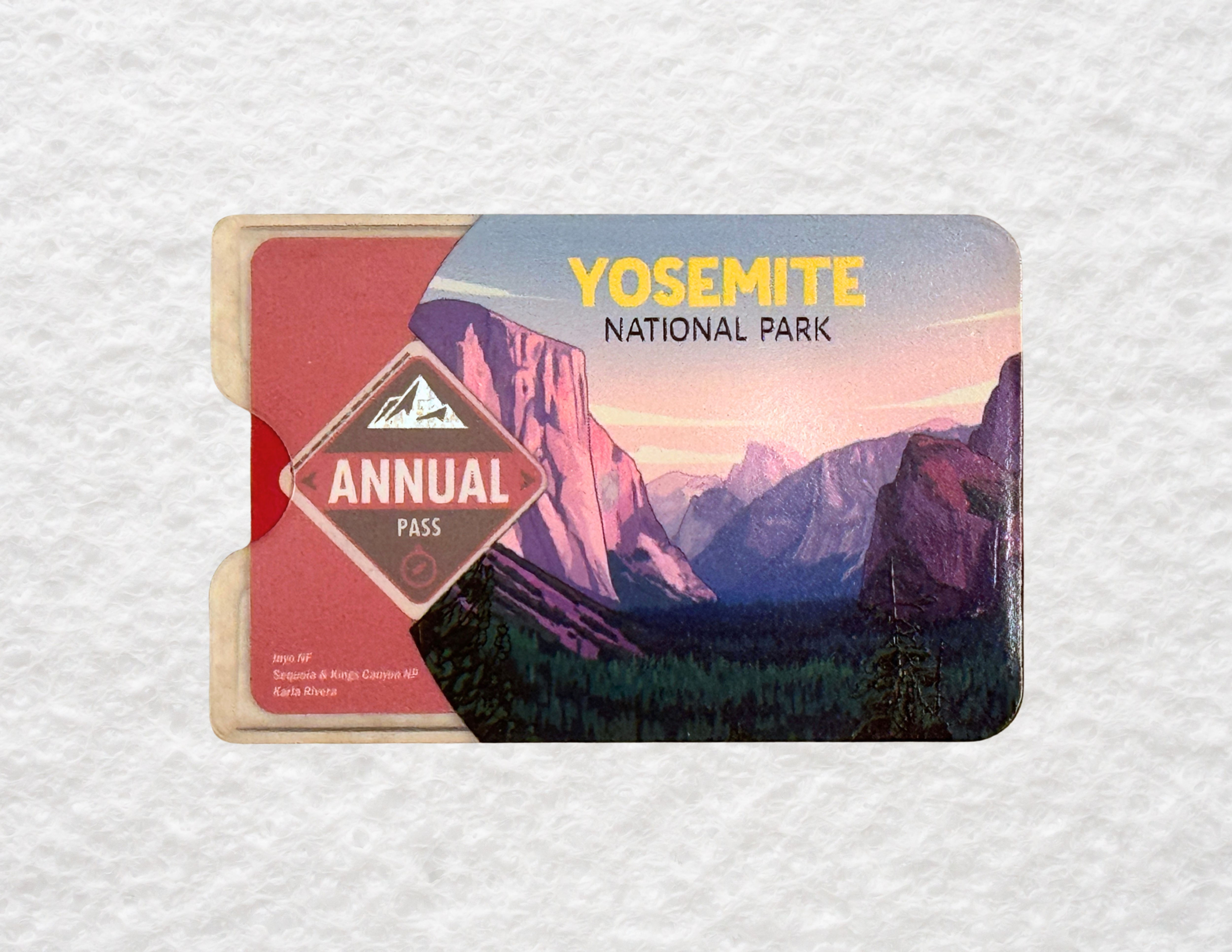 A translucent plastic sleeve for America the Beautiful National Park passes featuring a design of Yosemite National Park