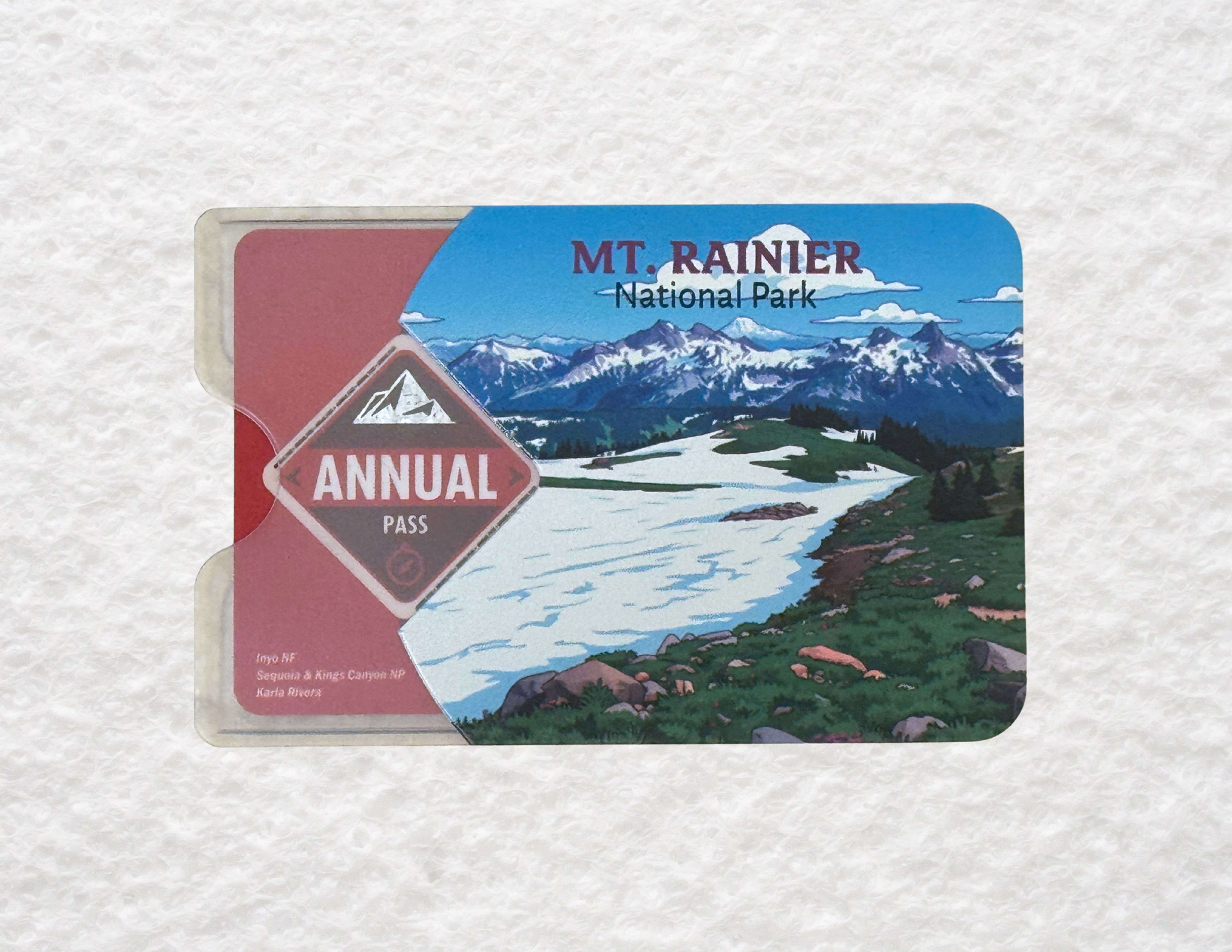 A translucent plastic sleeve for America the Beautiful National Park passes featuring a design of Mt. Rainier National Park
