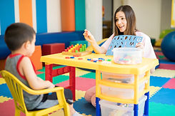 Cute Hispanic language therapist working