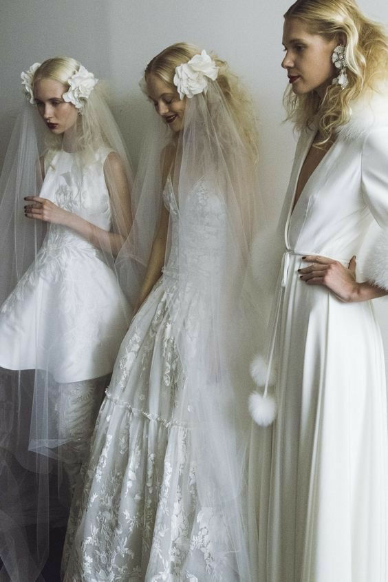 bridal models waiting backstage wearing editorial headpieces