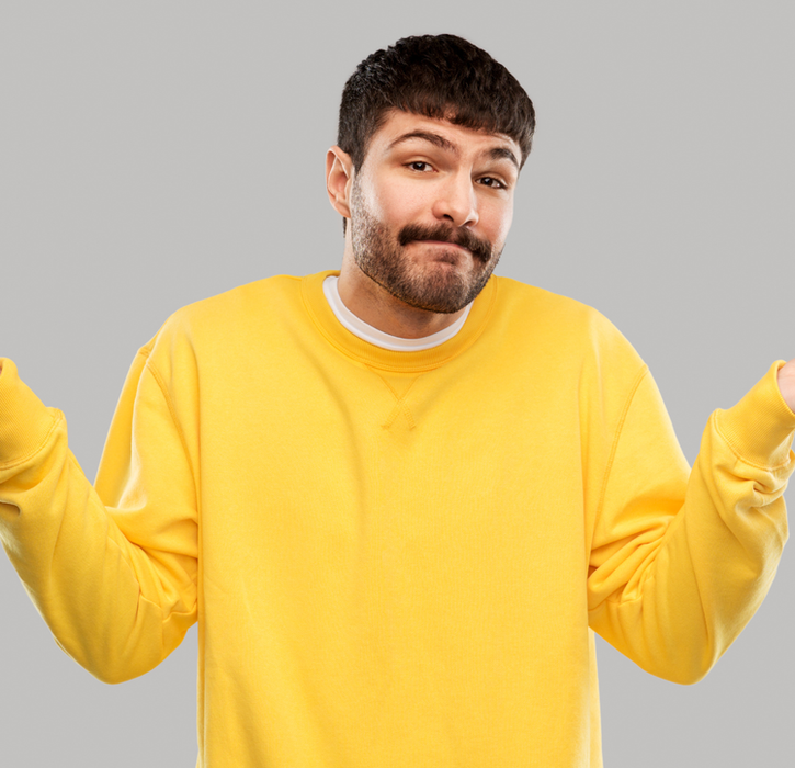 Yellow jumper man shrugging
