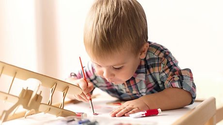 Child%20Painting%20Model%20Airplane_edited.jpg