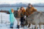 the kilcher family outside with their cow