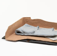 pile of cardboard and fabric like ceramic